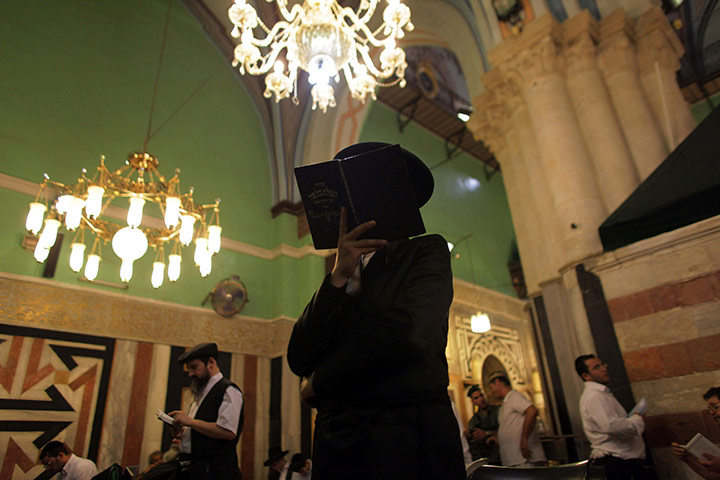 24 hours in pictures: Ultra-Orthodox Jews pray inside the Tomb of the Patriarchs