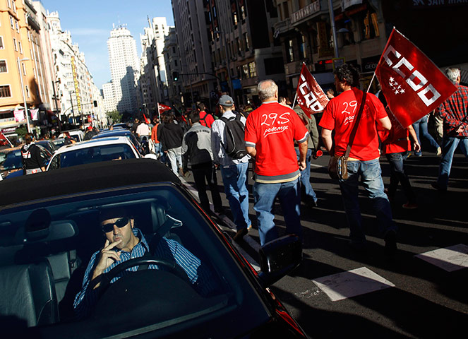 European strikes: A driver tries to drive along Madrid's Gran Via boulevard, Spain