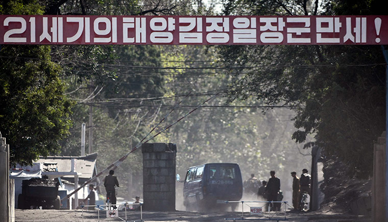 North Korea conference: Banner reads Hurrah General Kim Jong Ill the son of the 21st century's sun!