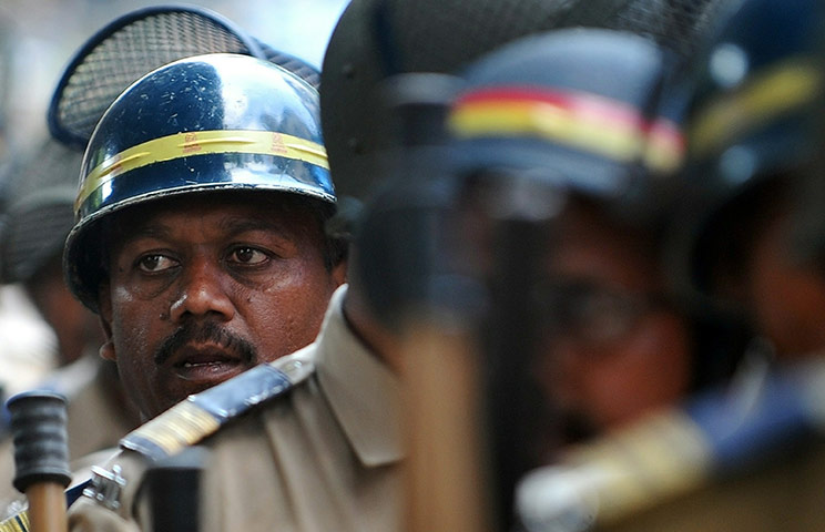 24hours Wed: Indian policemen march in a peace rally