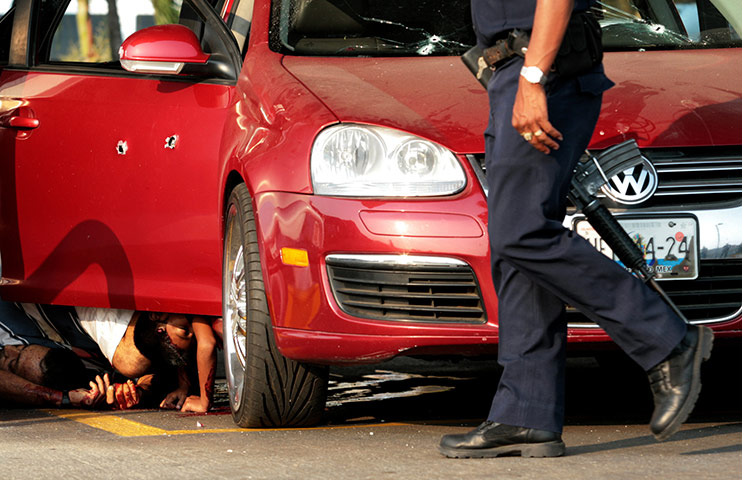 Mexico drug war update: Bodies astride a bullet-riddled car n the Guerrero state, Mexico
