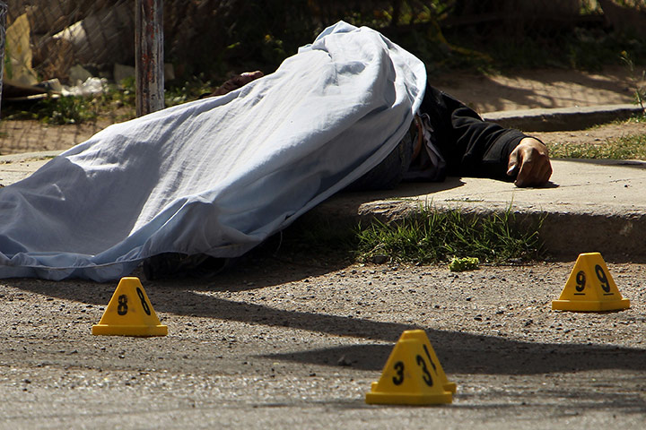 Mexico drug war update: A man lays dead in the street after being shot in Juarez, Mexico
