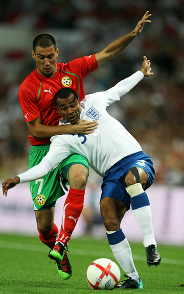 England v Bulgaria: Ashley Cole is tackled by Ivelin Popov