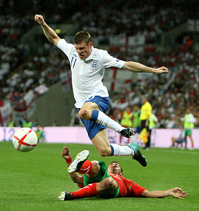 England v Bulgaria: Chavdar Yankov uses more orthodox methods to disposess James Milner