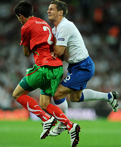 England v Bulgaria: England's Phil Jagielka collides with Stanislav Manolev 