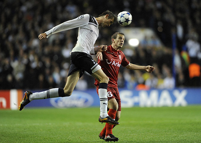 Champs League Wed:  Tottenham's Peter Crouch beats FC Twente's Wout Brama in the air
