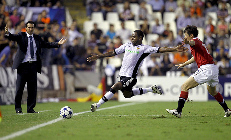 Champs League Wed: Luis Miguel Brito clears the ball as Park Ji-Sung closes in