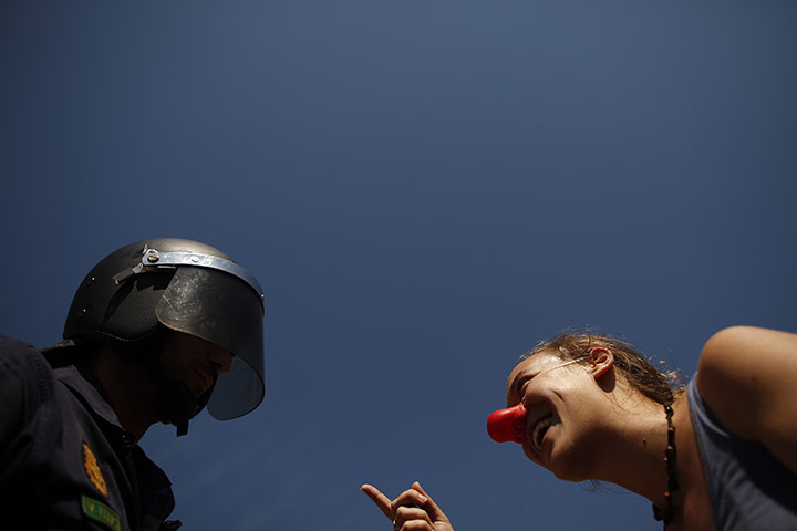 24 hours Thurs: A picketer speaks to a riot policeman during a nationwide general strike