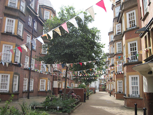 Liverpool Road: Rows of bunting strung across housing blocks