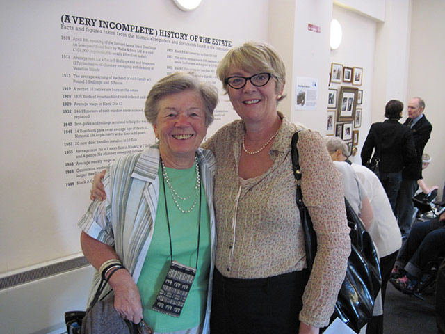Liverpool Road: Two older woman arm in arm, smile at camera