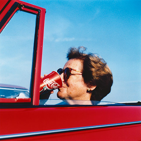 In Pictures: Red: woman in a ­classic 1960s ­Triumph Vitesse