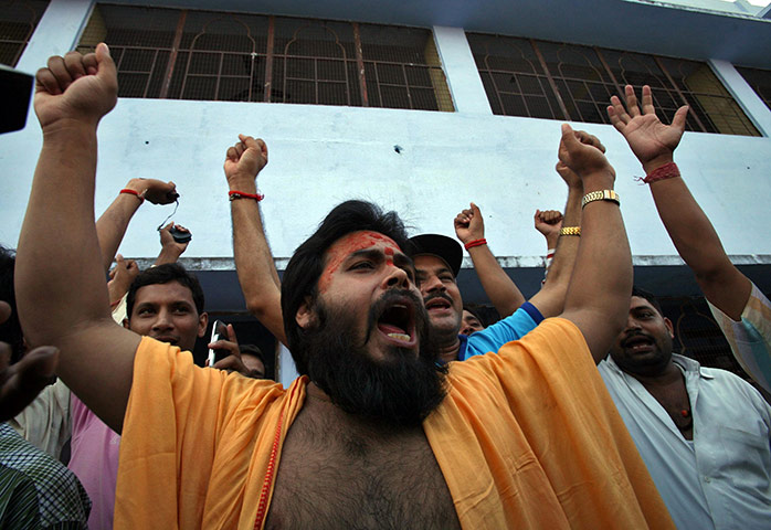 Ayodhya Update: A Hindu priest shouts slogans as he celebrates after the hearing