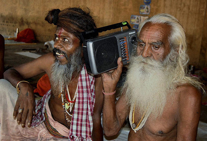 Ayodhya Update: Hindu holy men listen to radio news on the Ayodhya verdict in Mathura