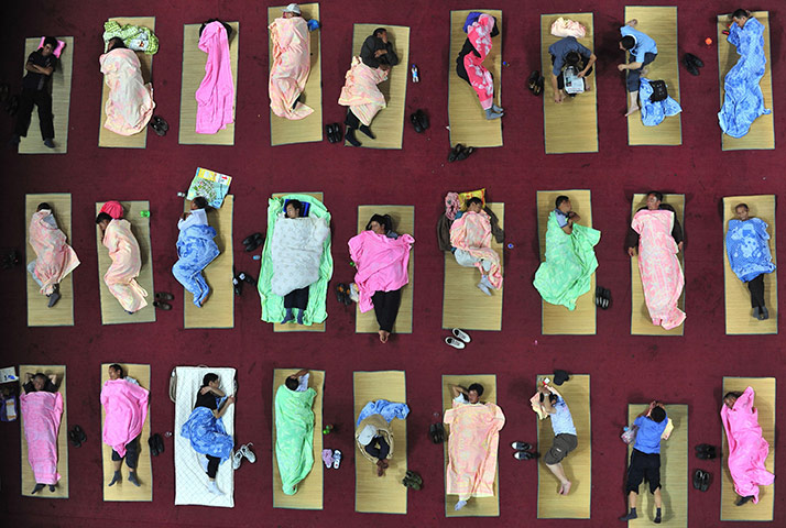 24 Hours: Parents of freshmen students sleep at a university campus in Wuhan, China