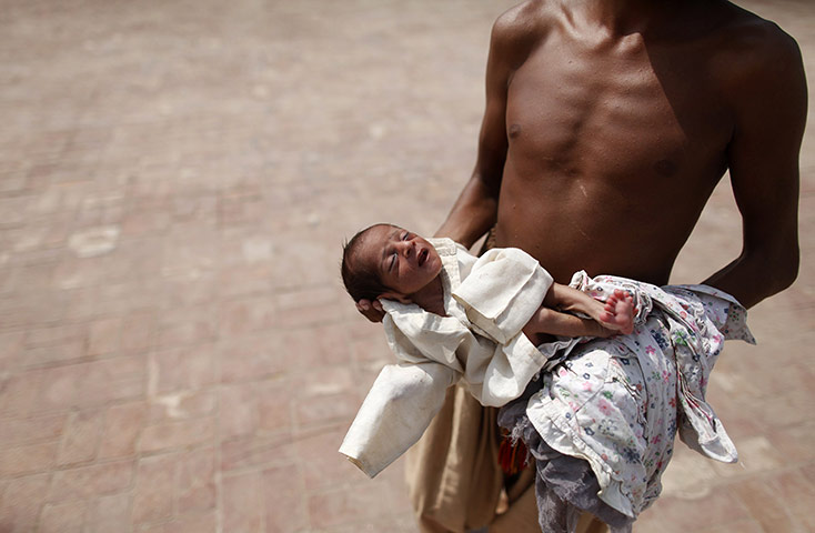 24 Hours: A baby is taken to the hospital in Pakistan's Muzaffargarh district