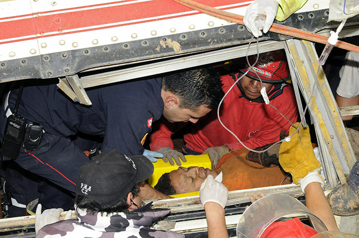 Guatemala landslide: Rescuers help a survivor in Guatemala Landslide