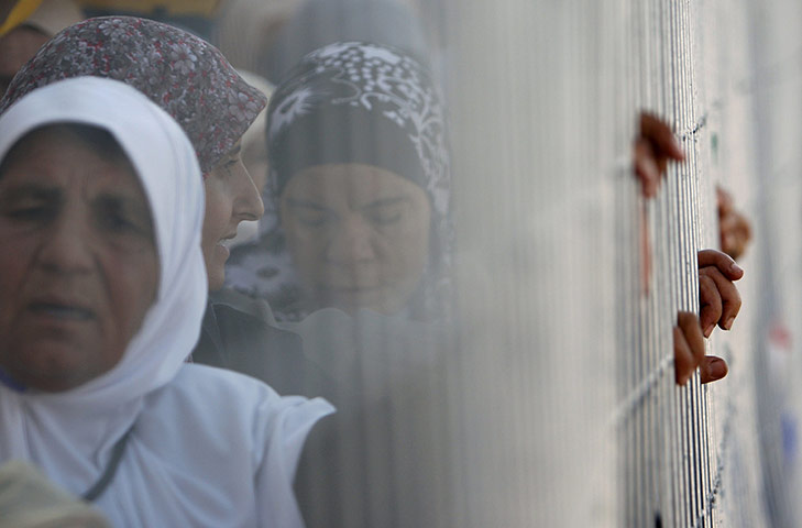 24 hours: Palestinian women wait in line to cross towards Jerusalem in Ramallah