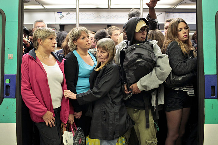 French Strikes: Commuters are seen in a crowded train of the Paris subway