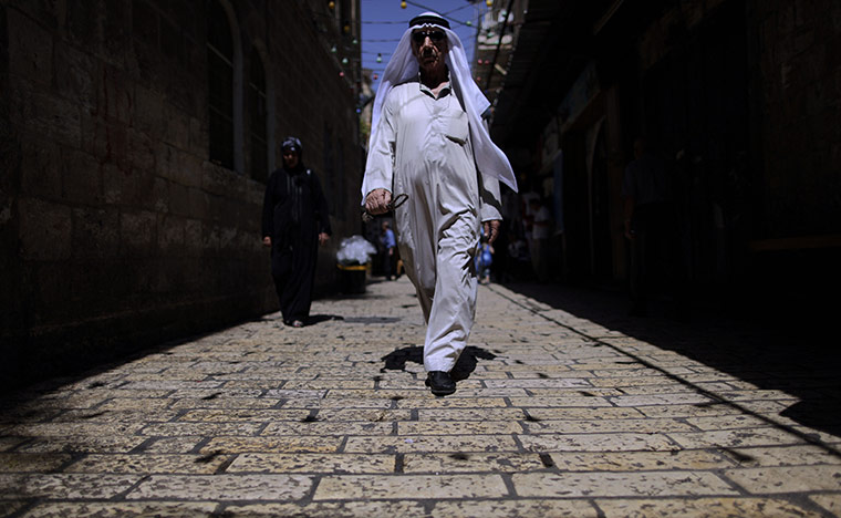 24 hours in pictures: Jerusalem: A Palestinian man makes his way through an alley of the Old City