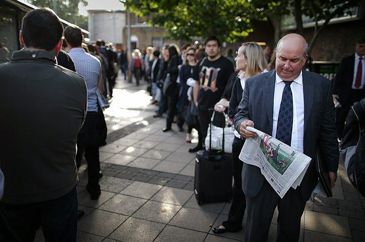 Tube stirke: Passengers line up to get on a bus near Waterloo Station