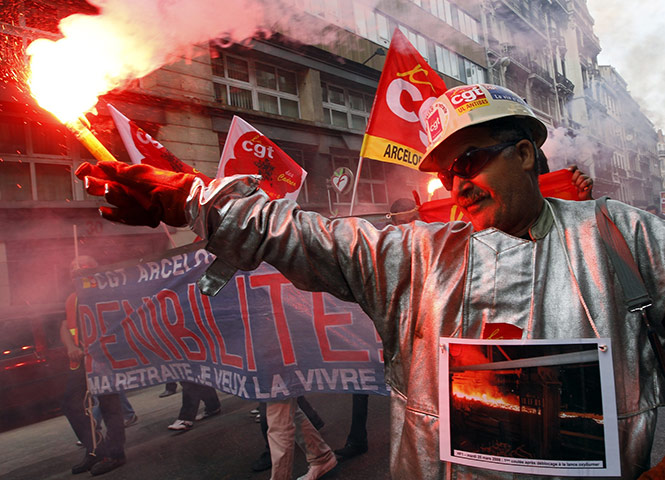 French Strike Update: Steel worker dressed in a protective suit demonstrates in Marseille
