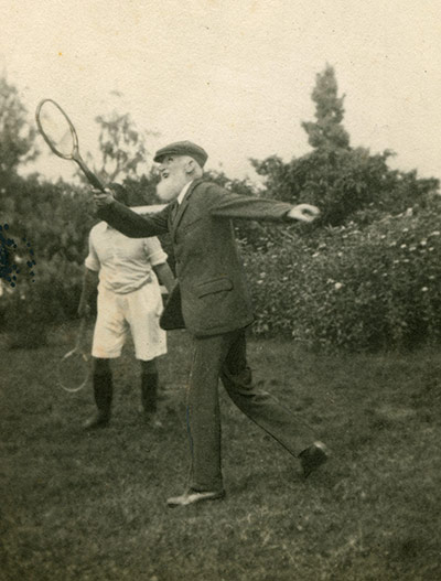 George Bernard Shaw: Shaw playing tennis in a suit and cap
