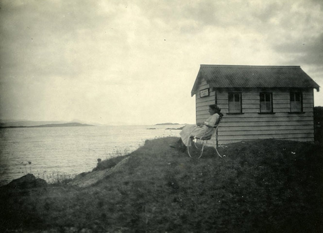 George Bernard Shaw: Charlotte Shaw [?] sits on a chair looking out over the sea