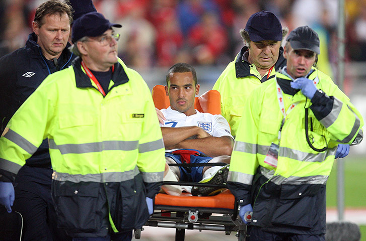 England v Switzerland: Theo Walcott is stretchered off after twisting his ankle