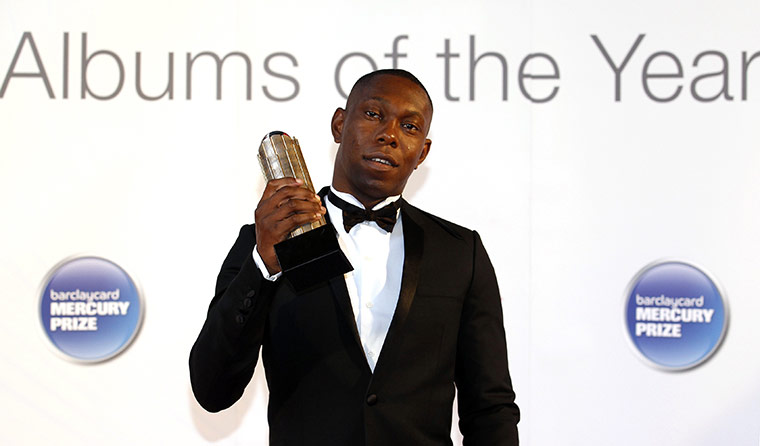 Mercury Prize 2010: Dizzee Rascal holds his nominee trophy as he arrives