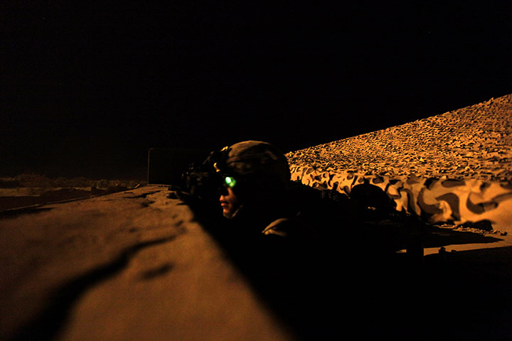 24 hours in pictures: US soldier with the 101st Airborne Division observes Taliban