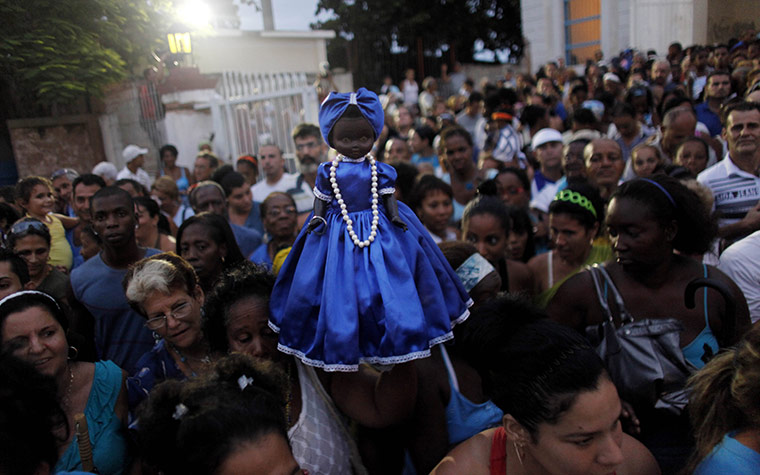 24 hours in pictures: Regla, Cuba: a doll of the Virgin of Regla during a procession