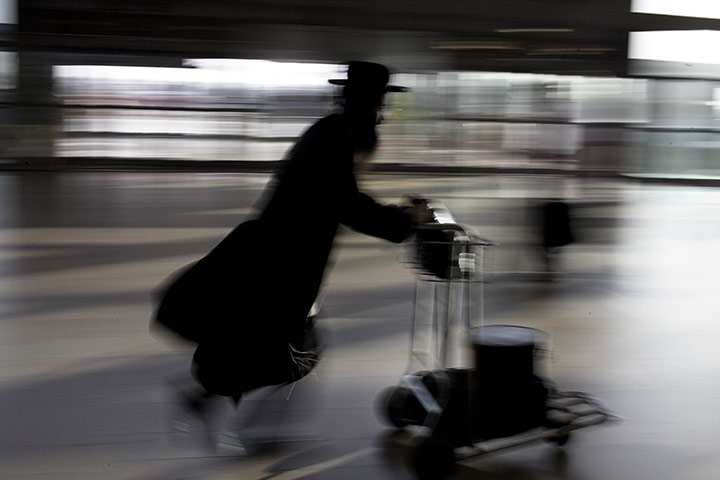 24 hours in pictures: Tel Aviv, Israel: An ultra-Orthodox Jewish man in Ben Gurion airport
