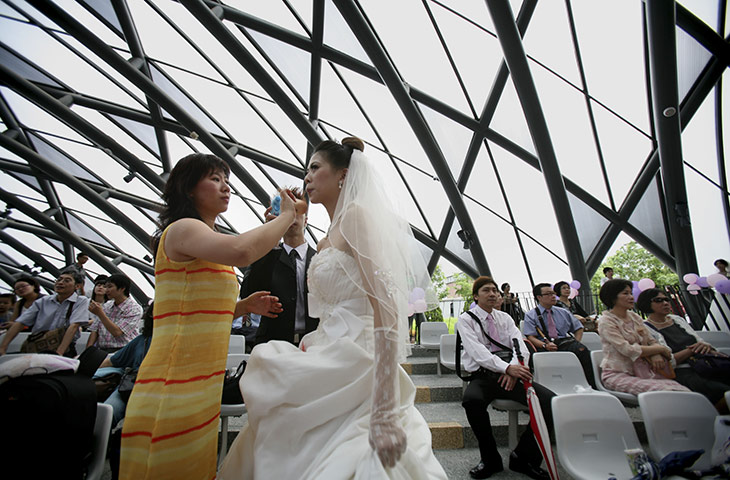 Mass Wedding Taipei: A bride gets finishing touches before a mass wedding in Taipei, Taiwan