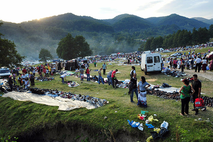 Roma celebrations: Romanian Roma sell second-hand clothes during the celebration of St Mary