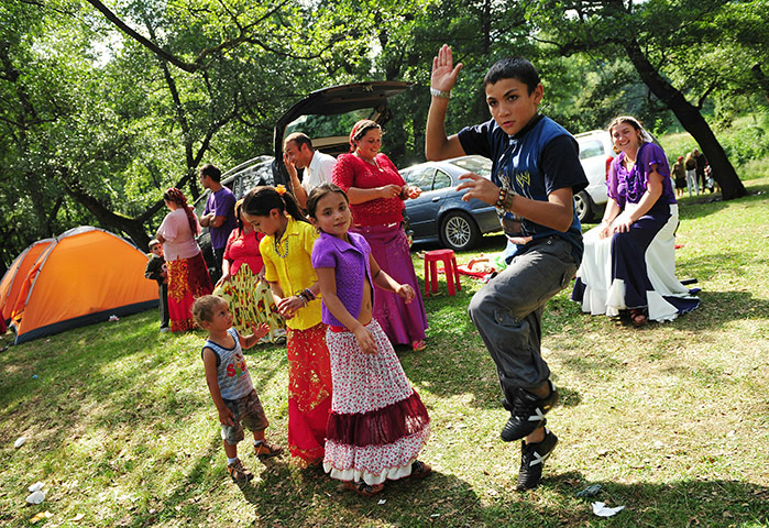 Roma celebrations: Romas dance during celebrations of St Mary's day in the village of Costesti