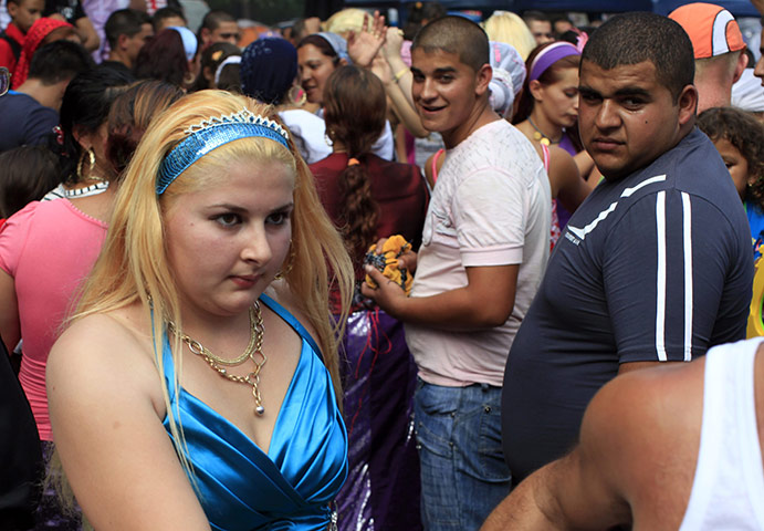 Roma celebrations: Roma boys peer after a girl