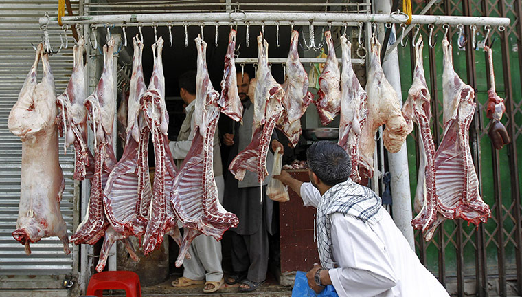 Eid Al-Fitr Festival: Afghan man buys meat from shop ahead of festival of Eid-al-Fitr in Kabul