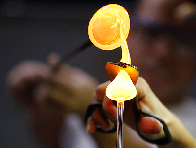 24 hours in pics: A worker of Riedel Glass company makes a wine glass in Kufstein