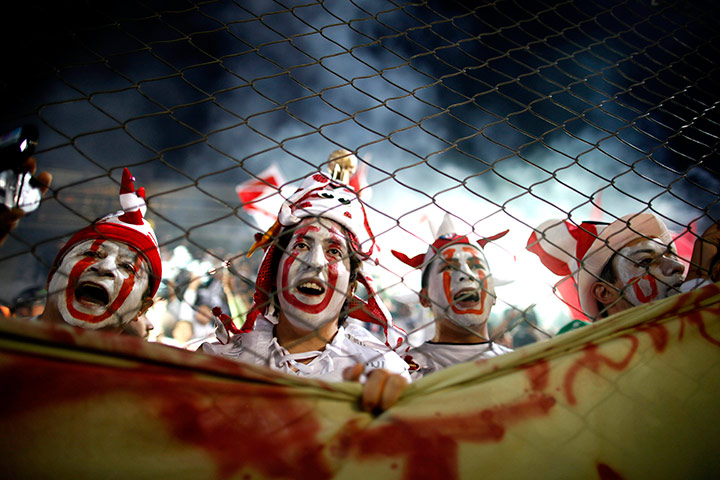 24 hours in pics: Fans of Ecuador's Liga Deportiva Universitaria, Argentina