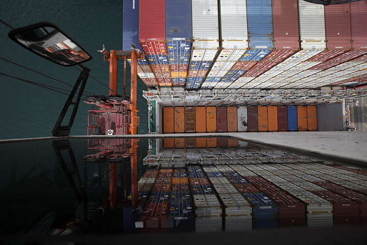 Week in Business: Containers aboard the OOCL Europe at the Long Beach Container Terminal
