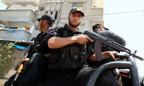 Hamas security forces ride a vehicle in Gaza