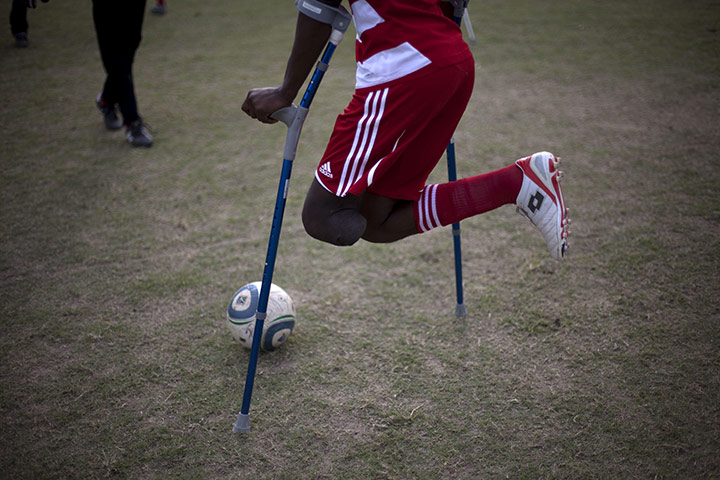 24 hours in pictures: amputee football team in Haiti