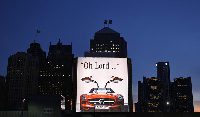 Detroit Auto Show: A Mercedes Benz SLS AMG billboard is shown on a building in Detroit