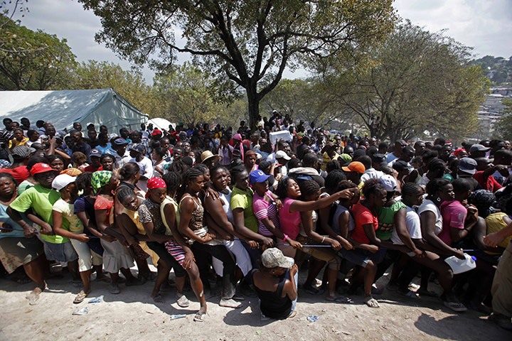 Haiti one year on: March 13: Women stand in line during a food distribution