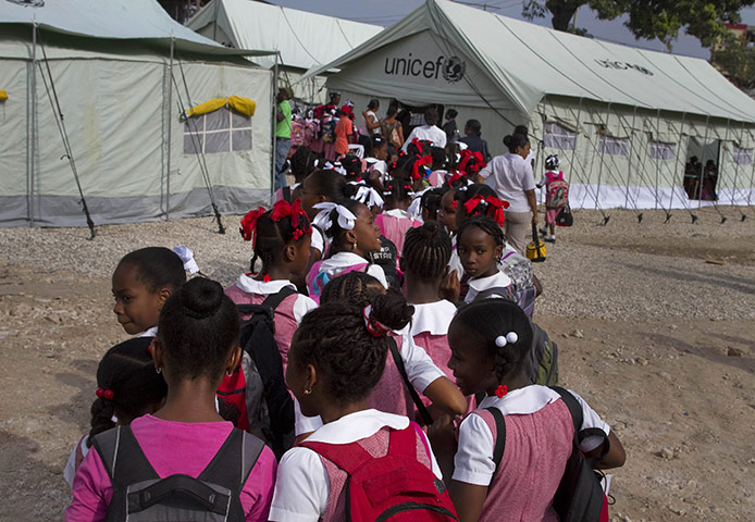 Haiti one year on: April 6: Pupils arrive for class at the Sacred Heart of Turgeau school
