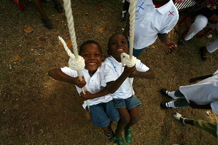 Haiti one year on: December 23: Haitian children await transport with adoptive parents 