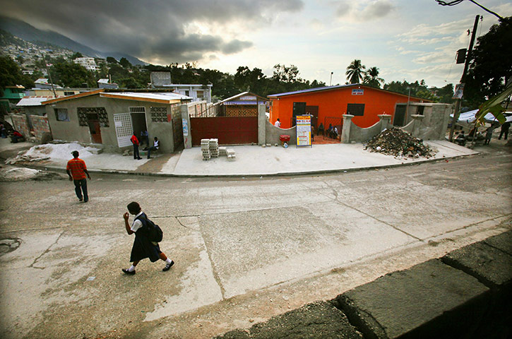 Haiti then and now: January 2011: The rebuilt St. Gerard University, right