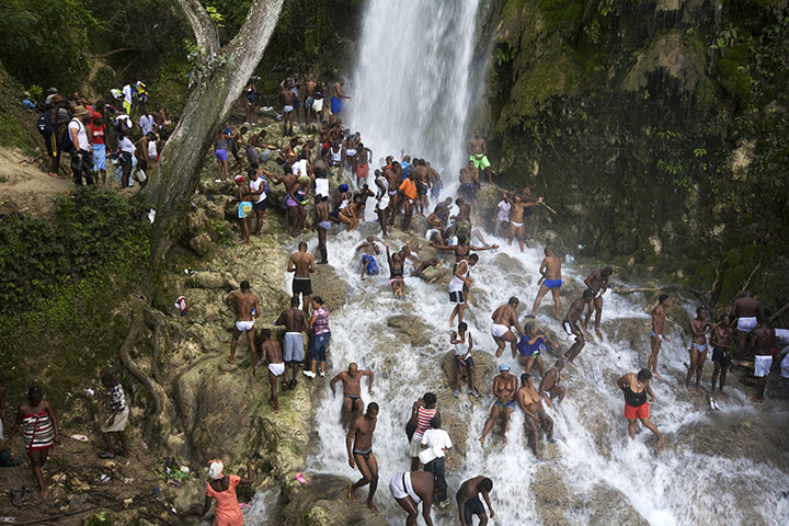 History of Haity: Pilgrims bathe and pray in the waterfall at Saut D'eau, Haiti