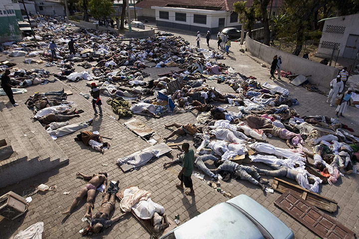 Haiti one year on: January 14: Thousands of bodies lay in front of the morgue 