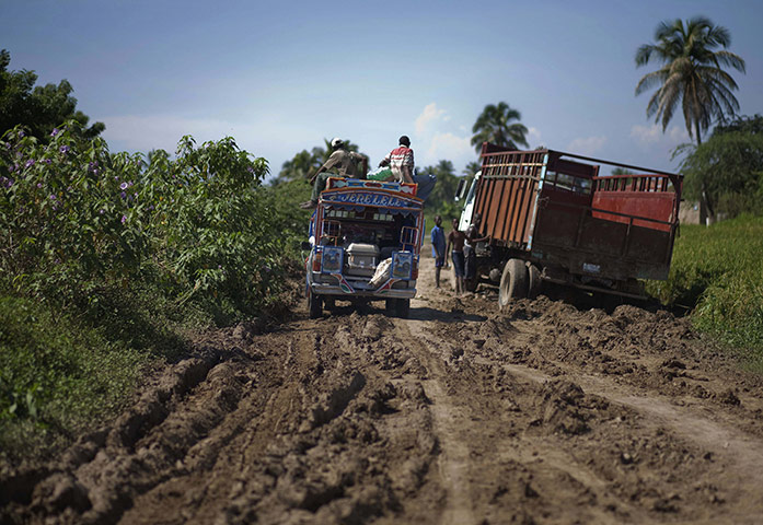 Haiti one year on: October 23: A taxi carries a coffin containing a cholera victim 